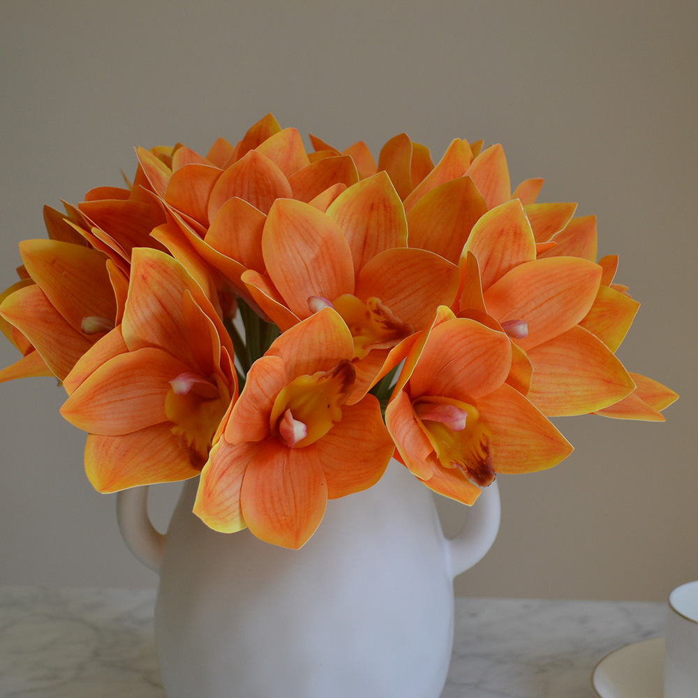 cymbidiums with bunches and flowers in hand, home model room decoration, dining table and coffee table decorations, fake flowers_voghion.com