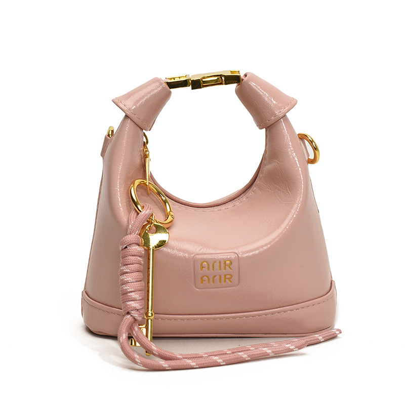 Bolso de hombro para niña coreana bolso de bebé con bloqueo de cuero de aceite de color sólido simple 2025 nuevo mini bolso para niños