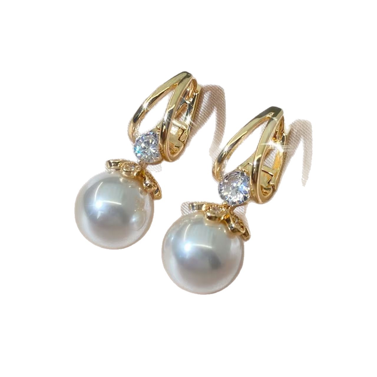 Nuevos pendientes de perlas estilo vintage, de alta gama y exquisitos, clips para las orejas de estilo femenino, pendientes de circonita ligeros, lujosos y versátiles, venta al por mayor.