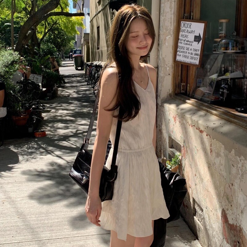 Sweet and Elegant Sleeveless Halter Dress with Drawstring Waist and Pleated Design in Cream Color Sweet and Elegant Sleeveless Halter Dress with Drawstring Waist and Pleated Design in Cream Color