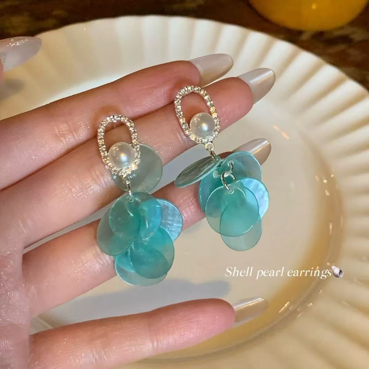 Blue earrings with tassels from pearl