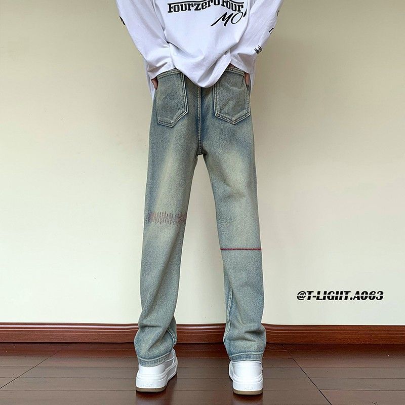 Nuevo producto Trend American White Retro Bordado Scratch Old Jeans Pantalones sueltos Hombres y mujeres Trendy Long