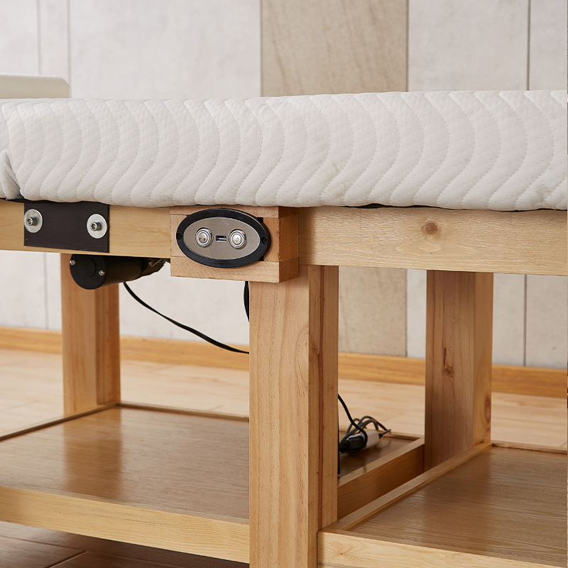 Cama de masaje eléctrica de fábrica cama de belleza de madera maciza salón de belleza de látex de alta calidad tatuaje bordado cama terapia de masaje con agujero