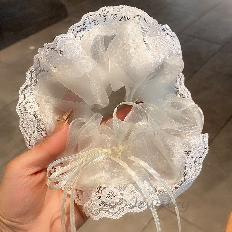 Corea del Sur Dongdaemun Mermaid Jiaxian encaje arco intestino grande círculo femenino nicho dulce cuerda de cabeza temperamento adornamiento de cabello super inmortal