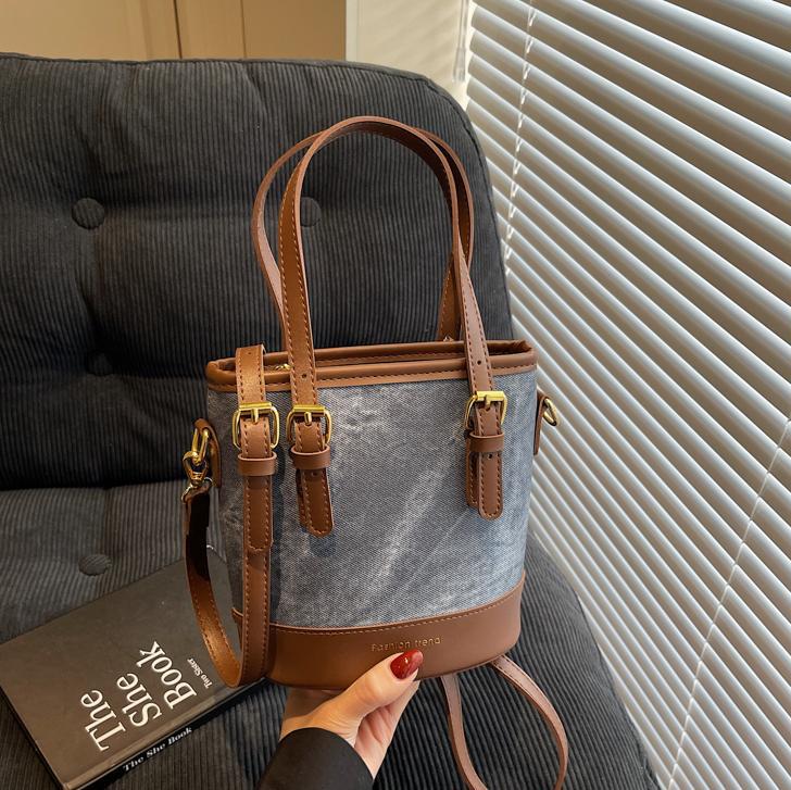 Bolso de mano de color de contraste de comercio exterior para mujer 2025 nuevo bolso de cubo de ocio salvaje simple bolso de mensajero de un solo hombro de alta gama