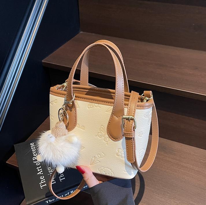 Bolso de mano de tendencia universal para mujeres 2025 nuevo estilo de moda de estilo exterior bolso de hombro casual de alta calidad textura mochila