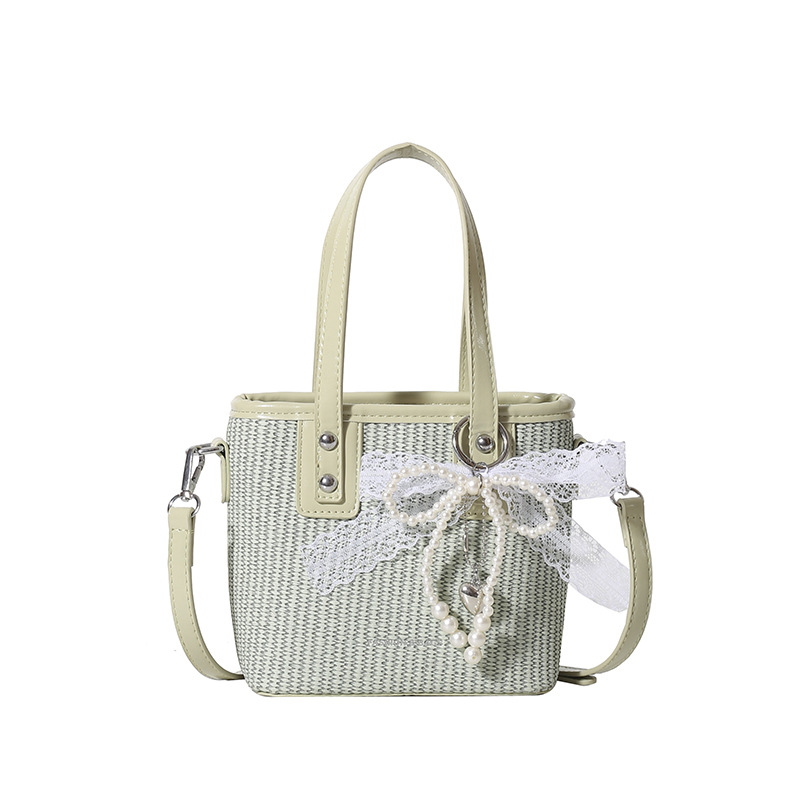 Bolsa de balde de mano caliente de verano para mujeres 2025 nueva bolsa de playa de vacaciones de playa bolsa de tejido bolsa de paja