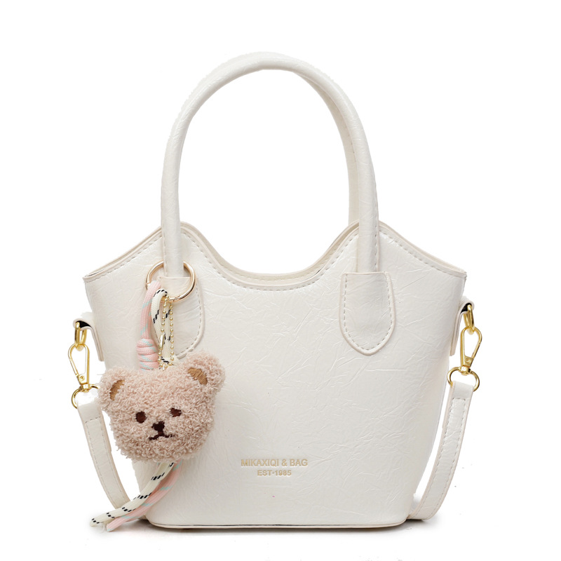 Versión coreana del bolso de cubo de mano casual simple para mujer 2025 nuevo bolso de hombro de viajero de todo fósforo bolso de mensajero de tendencia de moda