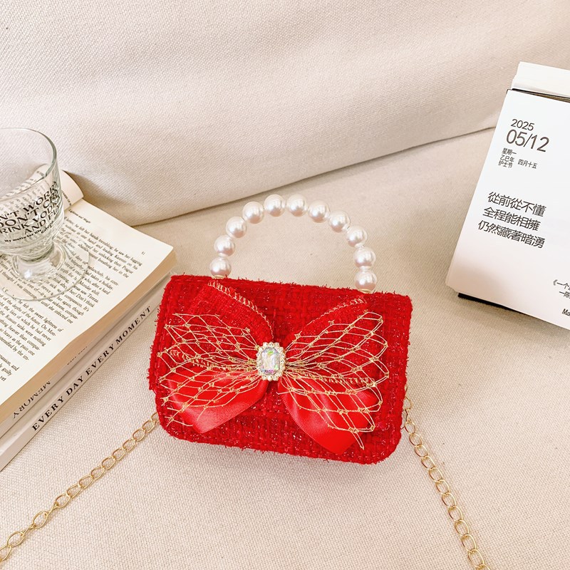 Pequeño viento rojo perfumado bolsos de Año Nuevo para niños y niñas lindos bolsos de perlas de arco 2025 nuevos bolsos de cadenas para niños