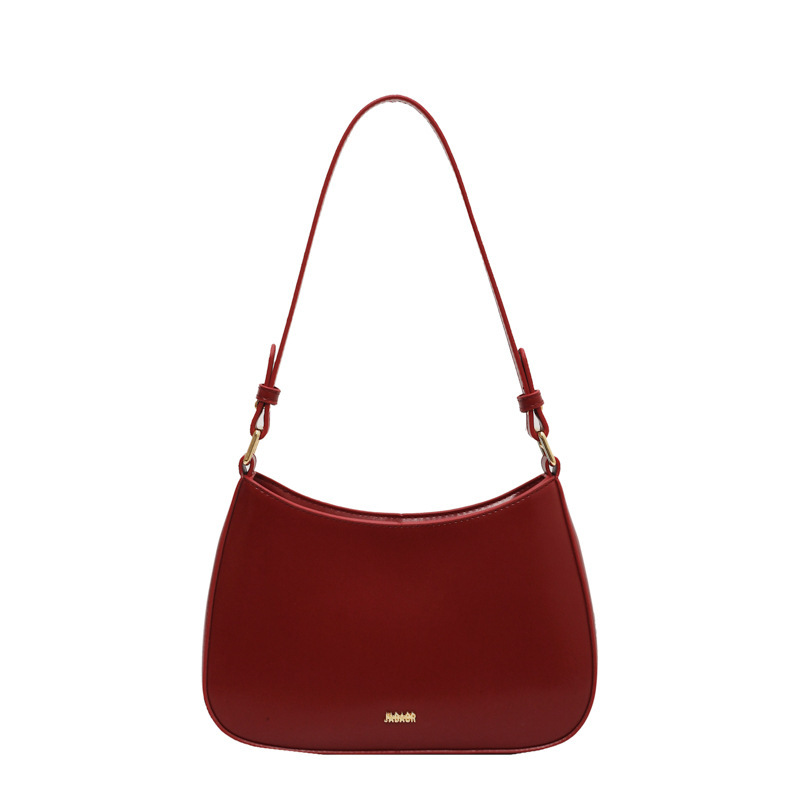 Bolso de moda de mujer 2024 verano nuevo estilo de moda bolso de brazo francés de textura simple bolso de palo nicho bolso de mochila