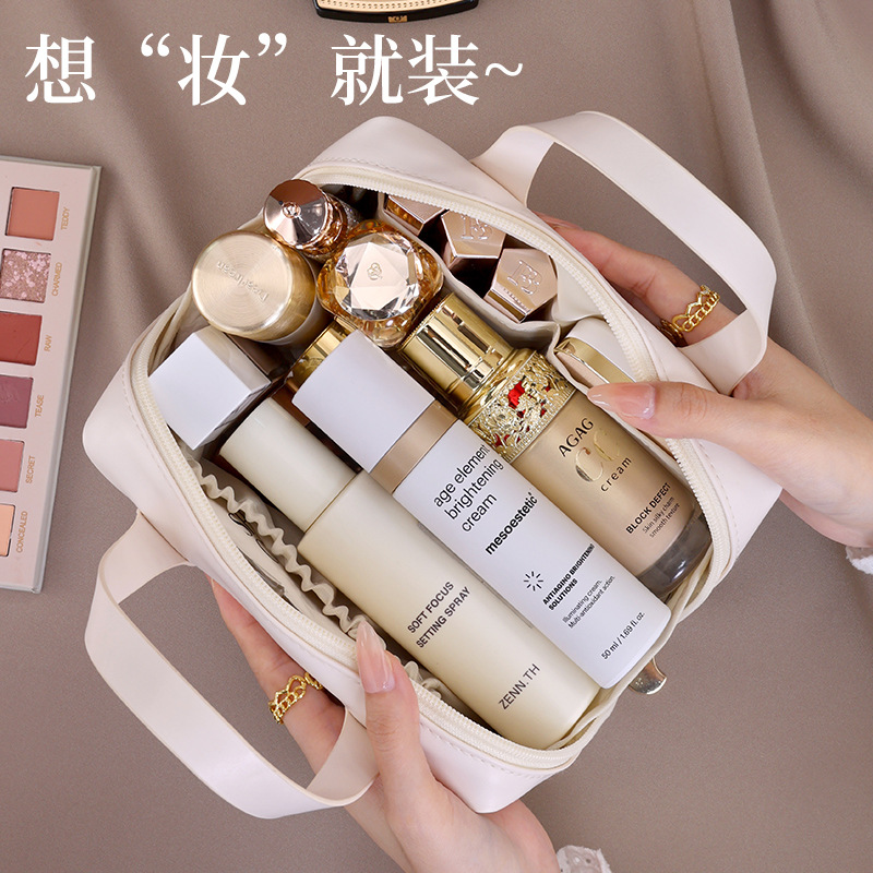 Luz de lujo francés pequeño bolso de maquillaje portátil multifuncional de alta calidad sensación de viaje bolsa de maquillaje portátil de mujer