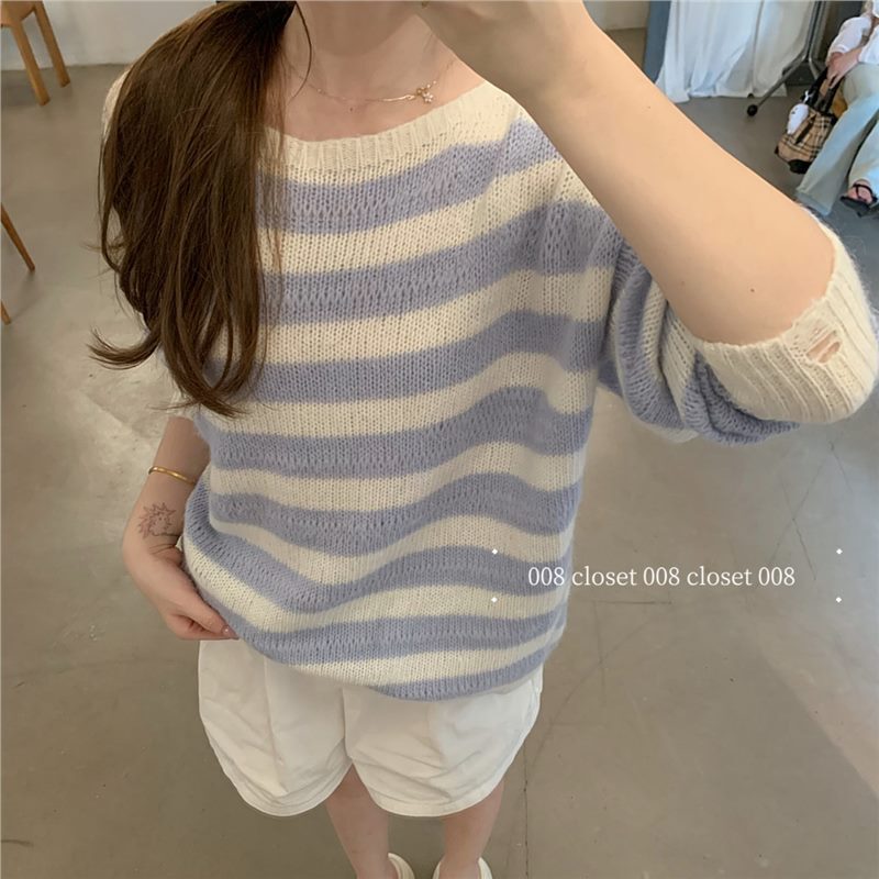 -008 closet-Blue and white striped sweater with a cozy vibe, low-saturation color palette, knitted