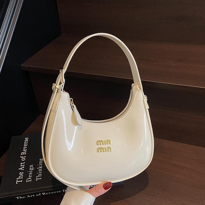 Bolsos de axila de nicho de moda para mujer 2025 nuevo bolso de bola de masa de cercanías con textura versátil, bolso de hombro de alta gama