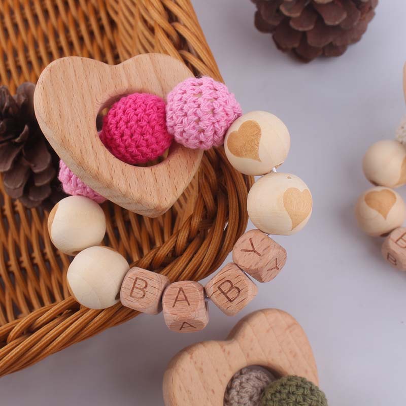 Bebé suministros de dibujos animados de haya amor mordedor creativo DIY dibujos animados amor patrón mordedura pulsera teether juguete