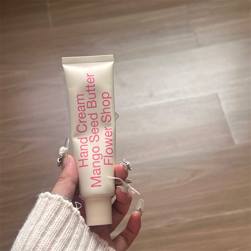 欧嘉莱尼ネットの赤い香水の双管のハンドクリームの秋冬のかわいい防乾のさわやかな手の膜のクリームの女性の世代のメーカーの卸売り|undefined