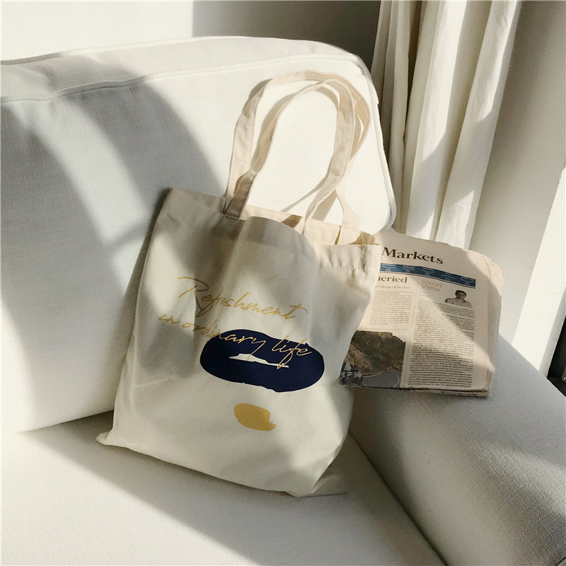 E131 canvas bag, Korean-style ins hand-held shoulder bag, color block letter graffiti shopping bag, female student's search for sources Item Picture
