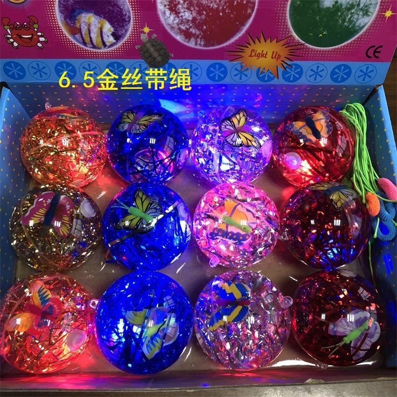 Cartoon con cuerda bola de cristal luminosa gran bola elástica sólida colorida mágica flash juguete para niños bola de salto