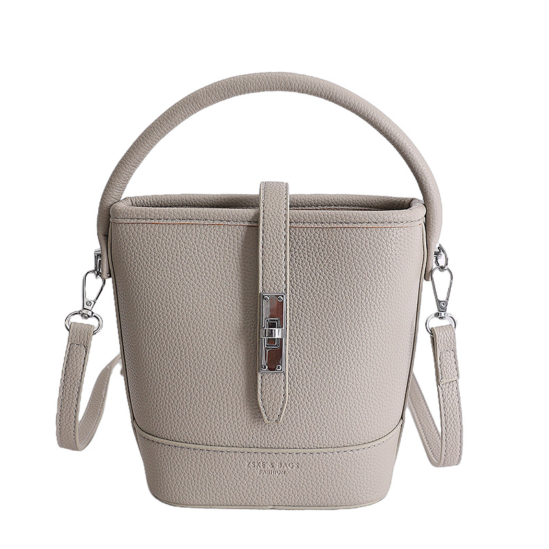 Litchi estampado bolso de cubo de mano mujer 2026 venta caliente nueva moda coreana alta textura mochila de hombro