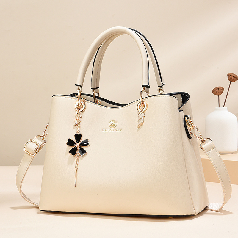 Colgante de flores bolsas de mano de color sólido de gran capacidad de moda versátil bolsas de hombro ocio de viaje oblicuo bolsas transfronterizas