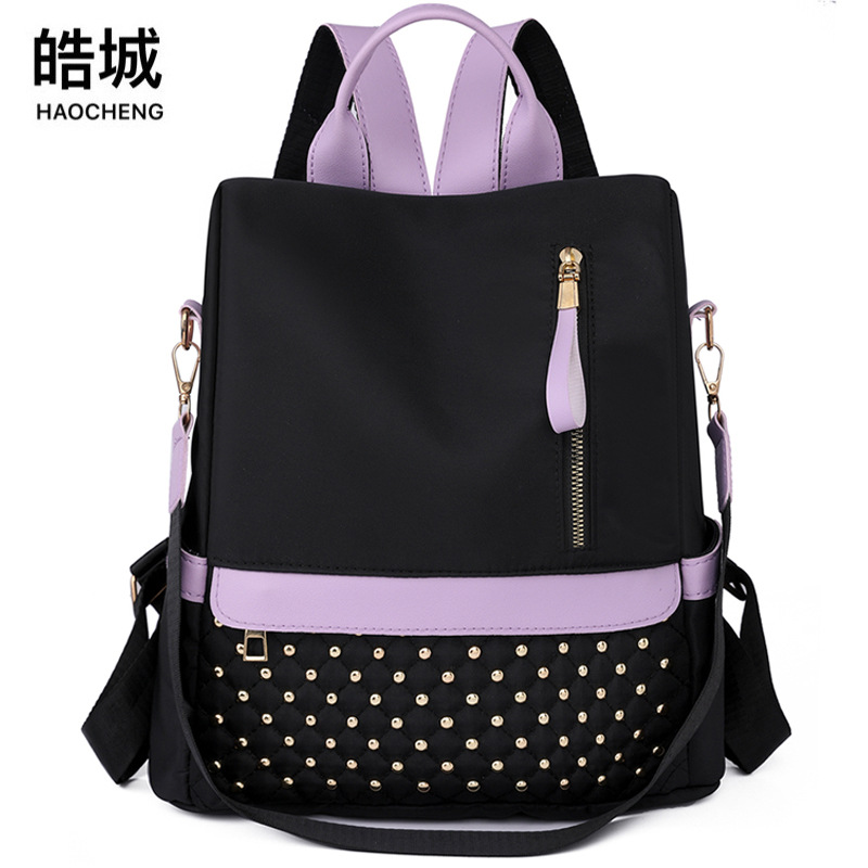 Mochila de nailon antirrobo para mujer 2023 nuevo estilo casual color de contraste mochila multifuncional de gran capacidad mochila escolar al por mayor
