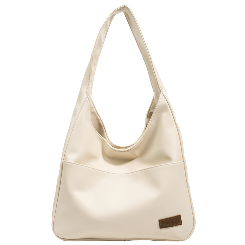 Bolso retro de gran capacidad para mujeres, nuevo bolso de textura, bolso de viaje para estudiantes universitarios, simple bolso de hombro casual.