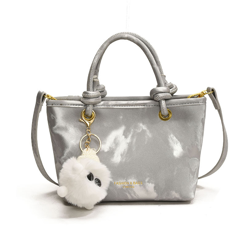 Bolso de mano casual simple coreano para damas 2025 nuevo estilo de transporte universal bolso de cubo popular mochila de hombro