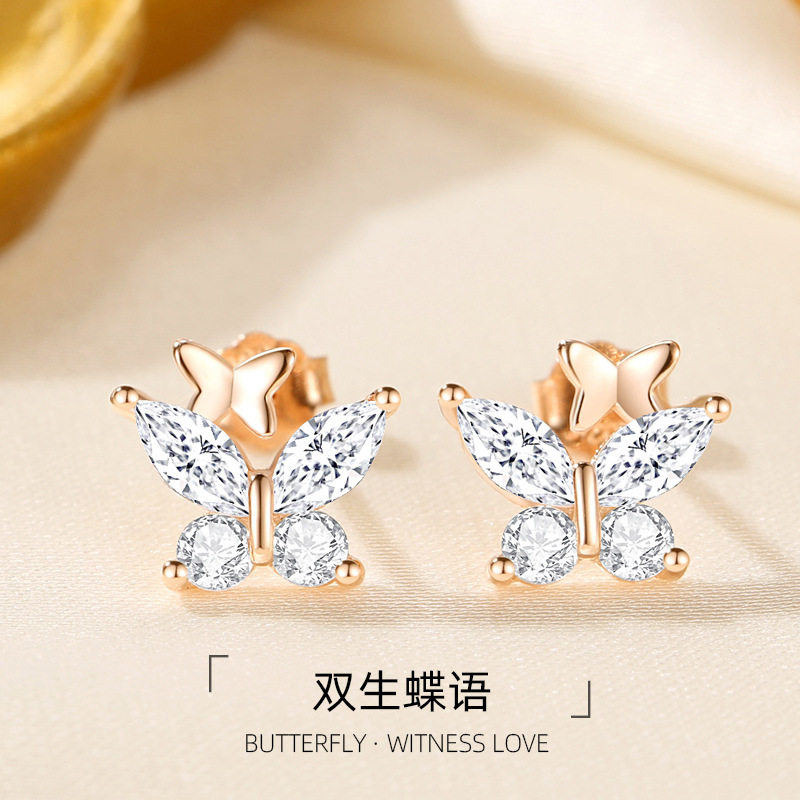 Los nuevos y elegantes pendientes de mariposa doble de diamantes flash plateados S925 lindos y dulces, pequeños y exquisitos pendientes de primavera y verano todos los días todo-fósforo