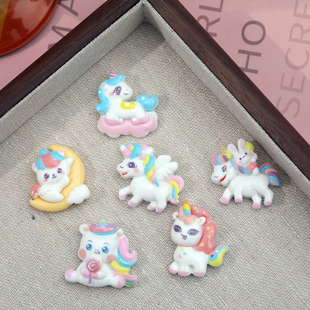 Dibujos animados Luna unicornio accesorios de resina DIY accesorios para el cabello teléfono móvil Shell papelería clave colgante hecho a mano material al por mayor