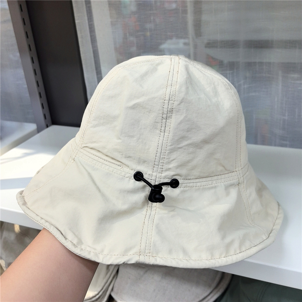 Korean-style lace-up fisherman hat for women—summer edition, direct purchase from Dongdaemun, inspired by bloggers, lightweight, windproof, and featuring a sun-protective brim.