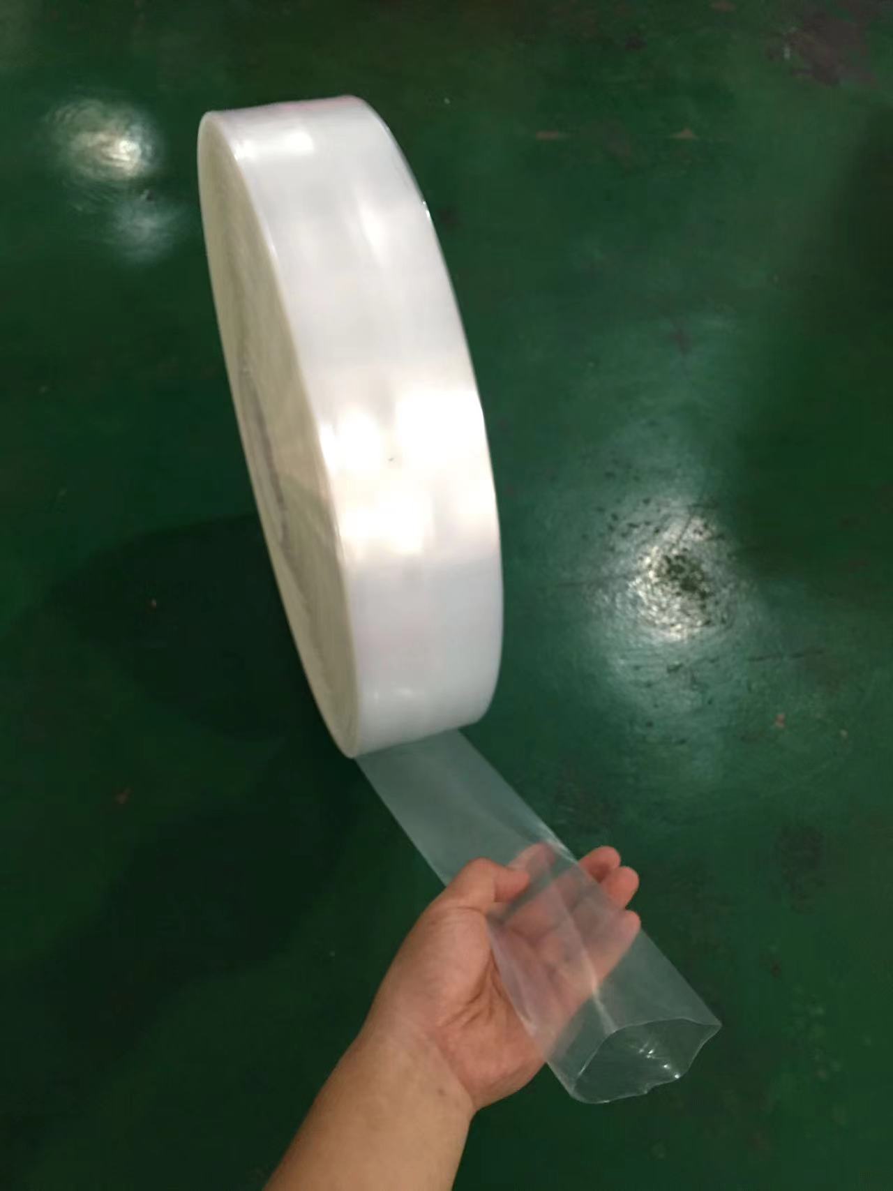 PE plano de alta presión espesado material de tubo transparente película de bobina larga a través de bolsa a prueba de polvo e impermeable embalaje industrial bolsa de PE