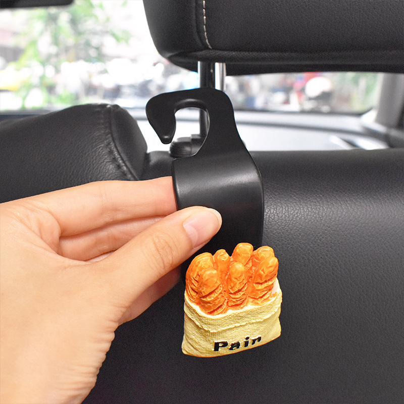 Gancho trasero del asiento del automóvil 2024 nuevo gancho pequeño multifuncional para automóvil lindo gancho para colgar en el automóvil de dibujos animados trasero