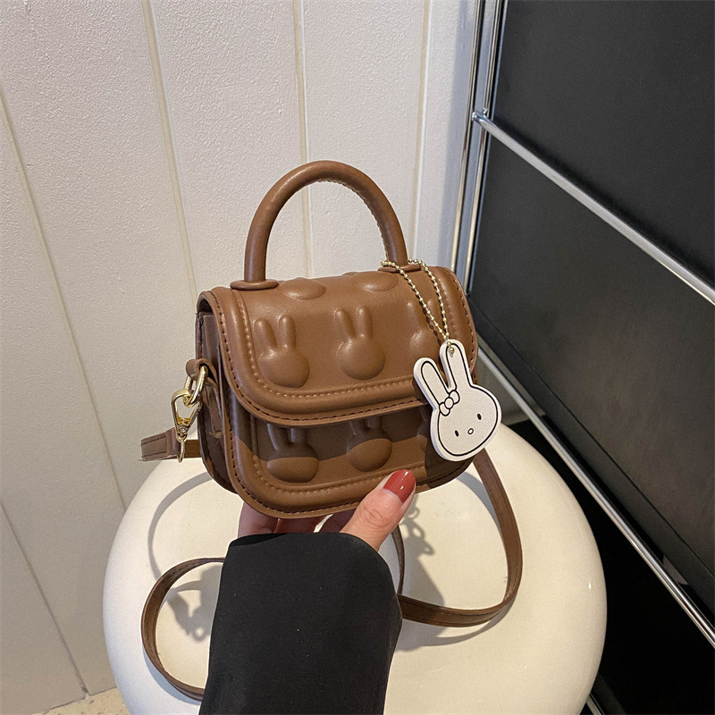 Bolsos para niños, bolsos de mochila encantadores, bolsos de moda de dibujos animados, bolsos de montar de mano, bolsos de cambio para bebés de niñas