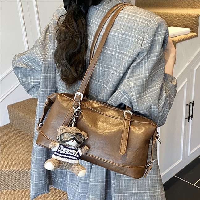 Coreano simple retro bolso portátil de Boston mujeres otoño / invierno 2025 nuevo estilo de alta sensación bolso de hombro bolso de brazo