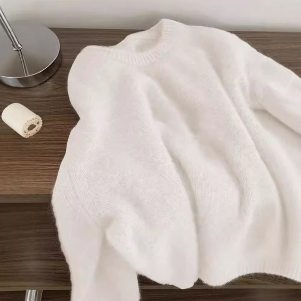 高級感の柔らかいモチモチのアライグマの丸首のセーターの女性の冬の厚い怠惰な風の乳のfufuの中でニットの上着を掛けます。
