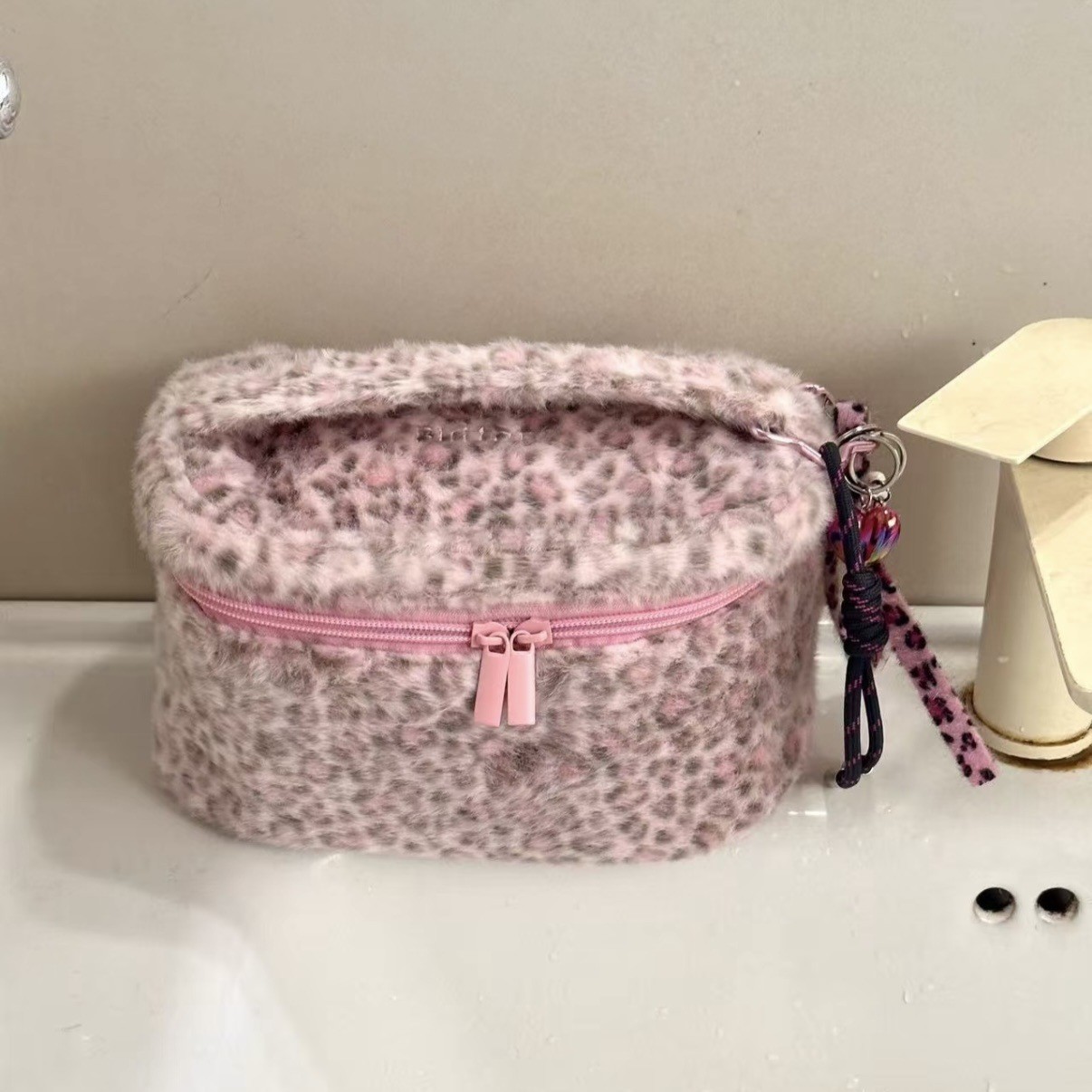 Fuchsia capacious cosmetic bag