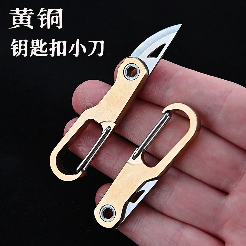 Brass keychain, sharp pocket knife, handheld box