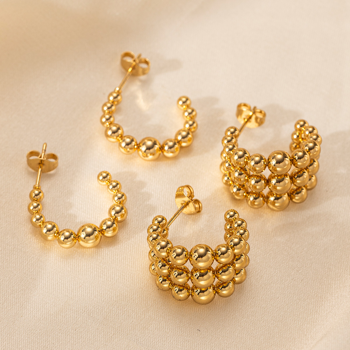 Taena Pendientes de acero inoxidable europeos y americanos, lujo ligero, costura redonda de alta calidad, pendientes semicirculares de acero de titanio, joyería femenina que no se desvanece