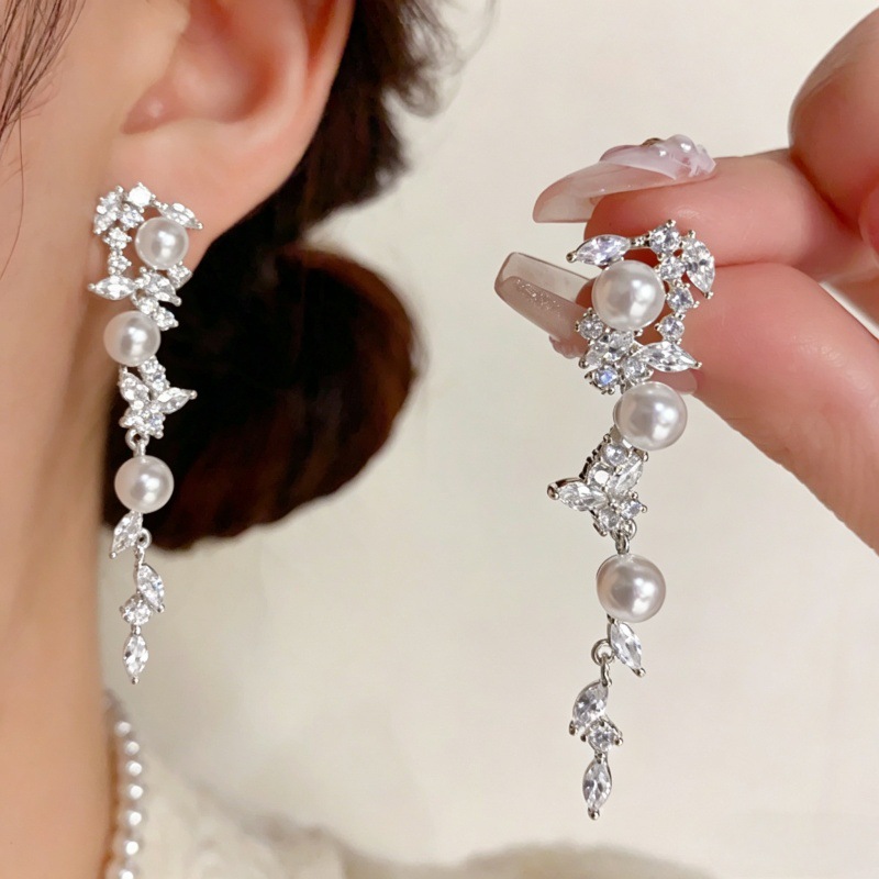 Elegant sophisticated universal earrings with tassels with zircon…