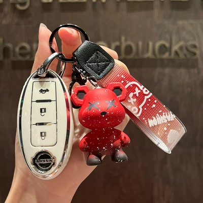 Car key bag: Qijun Qashqai Xuanyi Tuda - nissan-c-smart-3-key-single-shell-white-red-violence-bear-pendant
