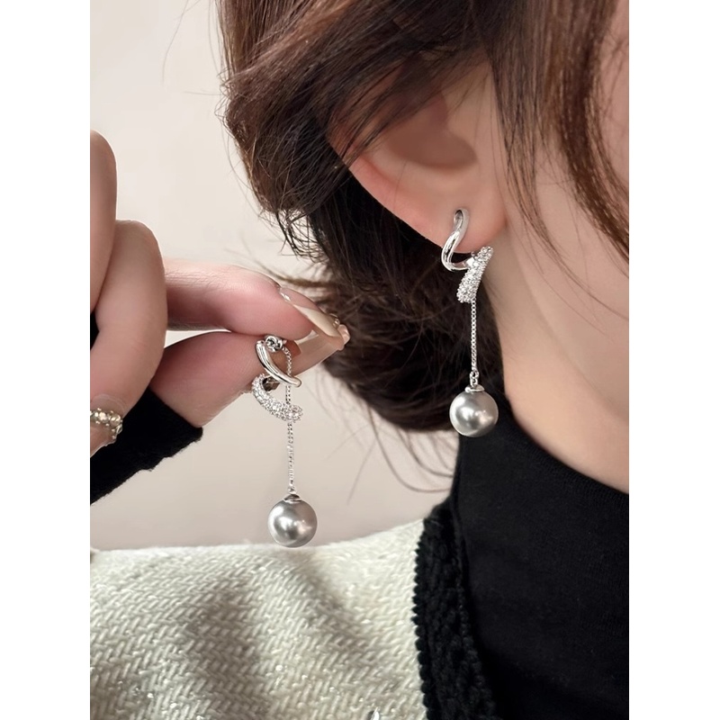 Fashionable long small design earrings with tassels from pearl