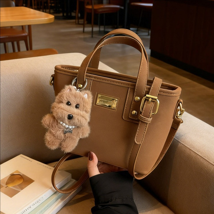 Alta sensación retro esmerilado bolso de cubo portátil 2025 otoño y invierno nuevo bolso de hombro de mujer de viaje versátil mochila