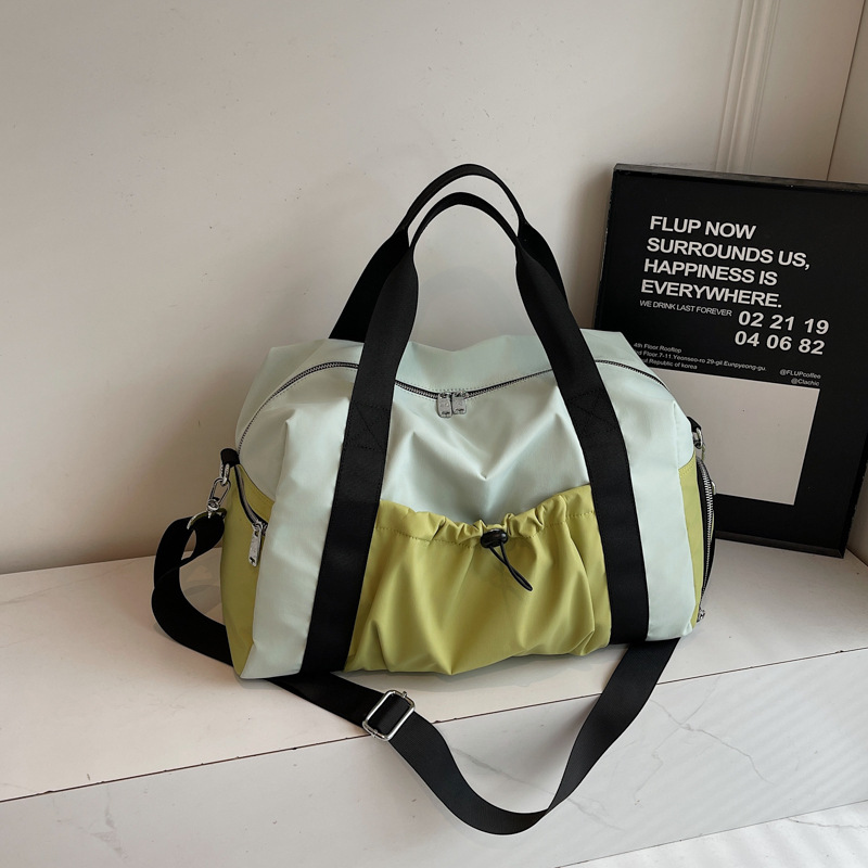 Bolsas deportivas de gran capacidad de ocio, bolsas de viaje de hombro simples de moda para mujeres, bolsas de mano ligeras de tirado.