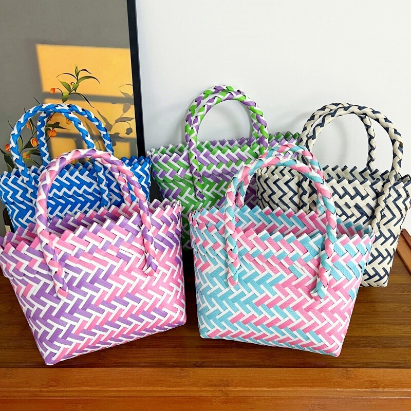 Handmade, fresh, and colorful woven bags with slanted edges, perfect as festive or wedding favors, tote bags, or gift bags with a rattan-like texture Handmade, fresh, and colorful woven bags with slanted edges, perfect as festive or wedding favors, tote bags, or gift bags with a rattan-like texture