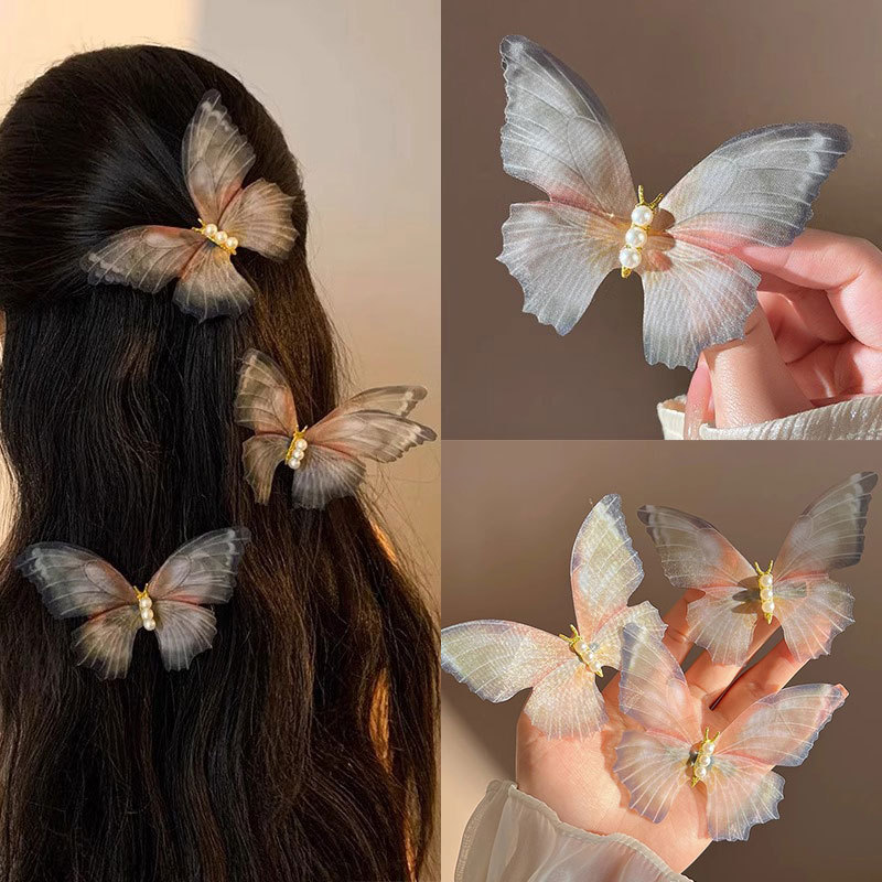 Clip de cabello de mariposa móvil ultra inmortal electrónica azul tulle perla clip de boca de pato decoración accesorios de playa clip tocado