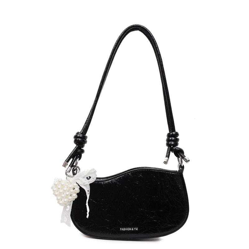 Bolsos pequeños de alta calidad 2025 verano nuevo estilo bolso femenino diseño de nicho bolso de hombro moda patrón de agarre de mano bolso de mensajero