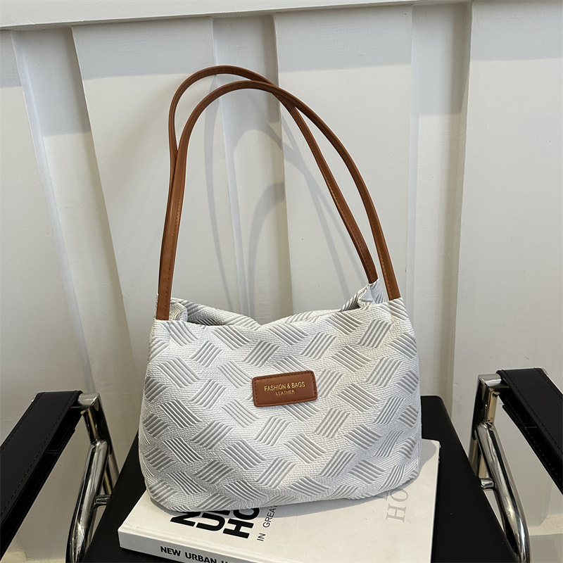 Nicho de diseño bolso de diamante para mujeres 2024 nuevo estilo de alta calidad sensación de gran capacidad portátil de viaje a mano rayas de hombro bolso