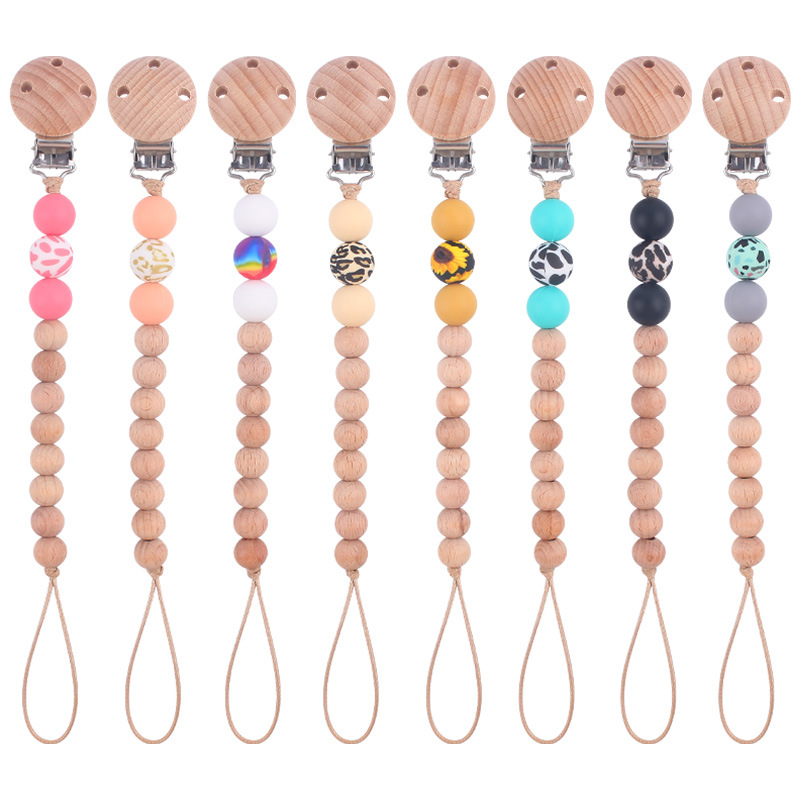 Nuevos suministros para bebés Beech chupete clip calmante bebé macaron cuentas impresas mordedura chupete cadena anti-caída de la cadena