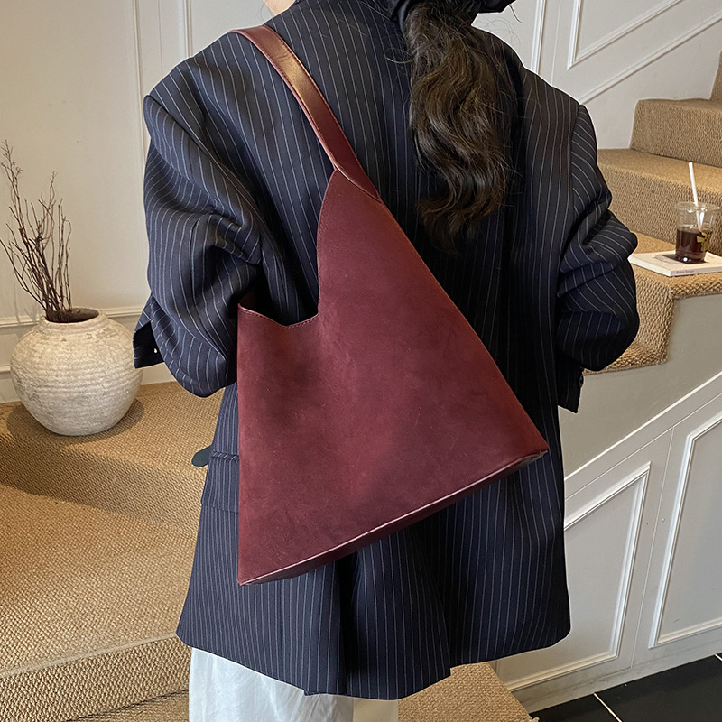 Bolsas de mano retro transfronterizas de mujer texturas bolsas de cubo de agua mujeres otoño y invierno 2025 nuevo mochila esmerizada bolsas de brazo de viaje