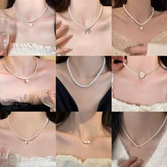 真金メッキ真珠ビーズ蝶ネクタイネックレス小衆百合通勤鎖鎖ファッション高級感アクセサリー女