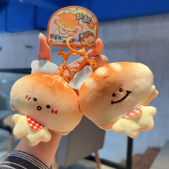 新商品のアイデアは、パン人のぬいぐるみのキーホルダーの女性のかわいいかばんのペンダントをめくるのがおかしい